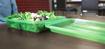 green containers with veggies