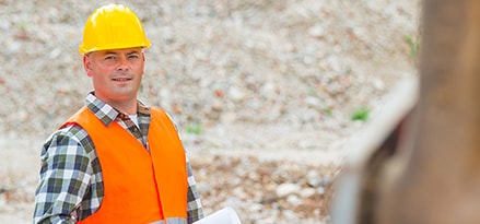 Construction worker with hard hat and plans