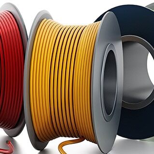 Spools of yellow, green, and red cable