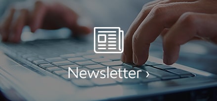 newsletter with hands on keyboard and letter icon