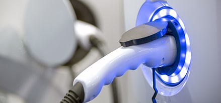 Electric charging vehicle being charged.
