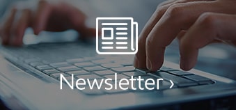 newsletter with hands on keyboard and letter icon
