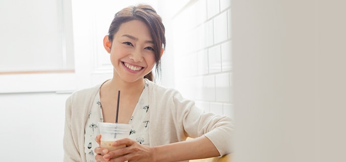 Girl iced coffee in plastic cup