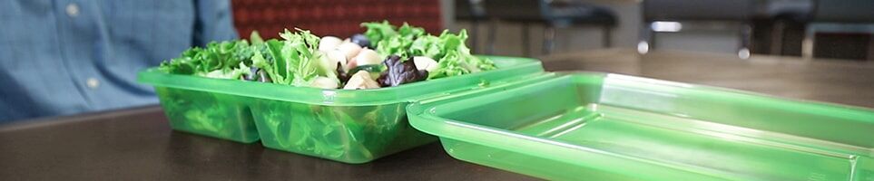 green containers with veggies