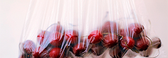 Cherries in plastic shopping bags
