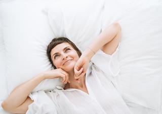 Woman Waking Up in Bed