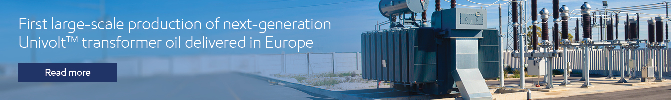 Outdoor electrical substation with a large power transformer and switchgear under a clear blue sky; text overlay about UnivoIt™ transformer oil.